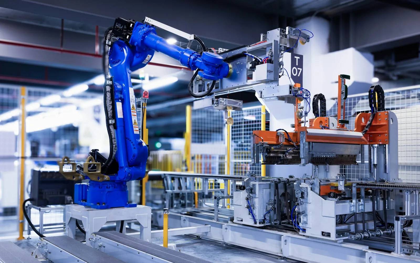 An industrial robot arm working on an automated production line.