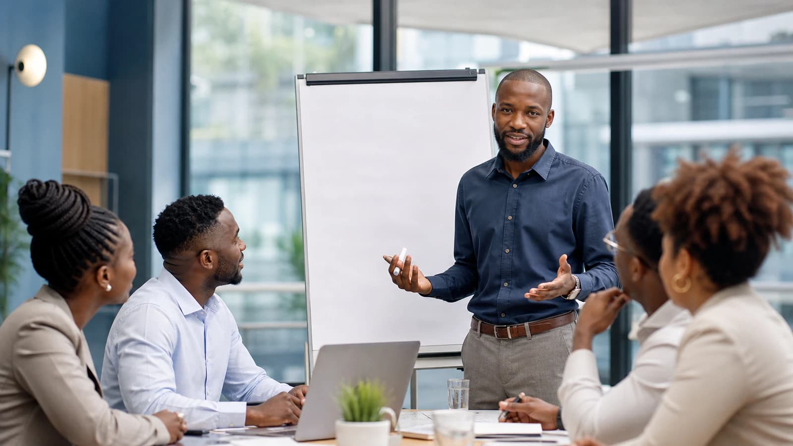 A facilitator leads a clear and engaged two-way team discussion.