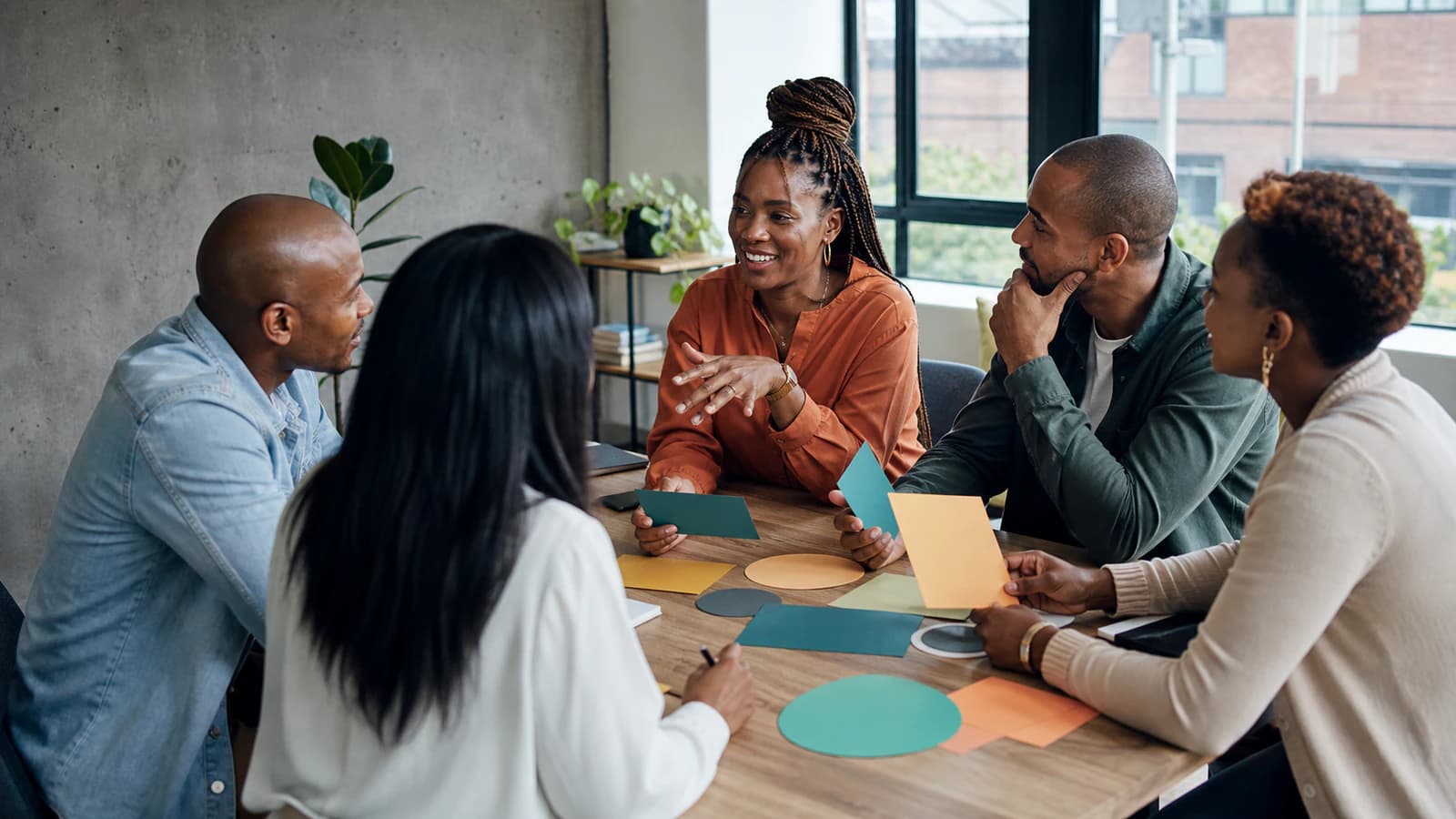 An inclusive team collaborates during a workplace culture workshop.