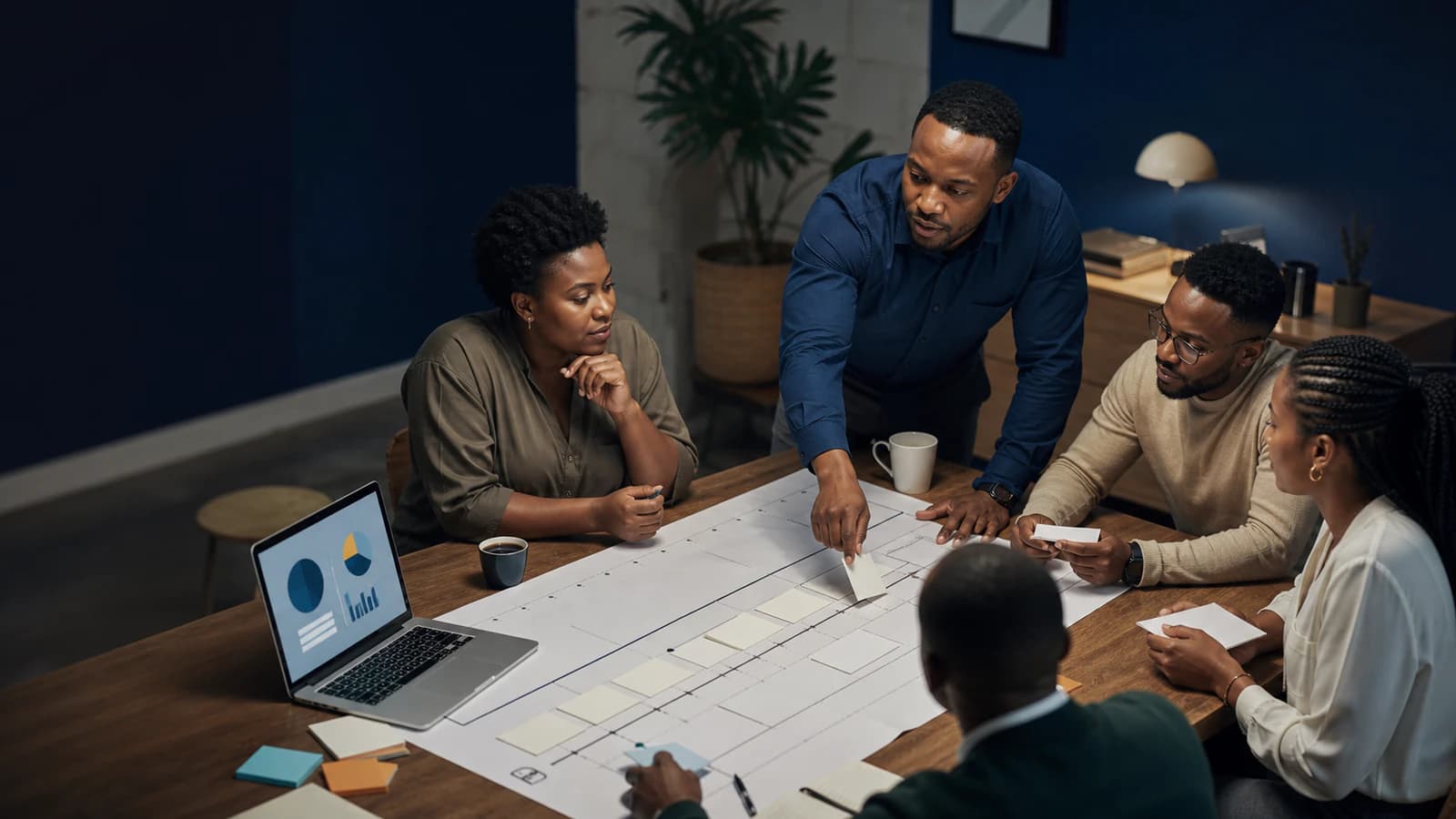 A project manager coordinates tasks and timing with a cross-functional team.