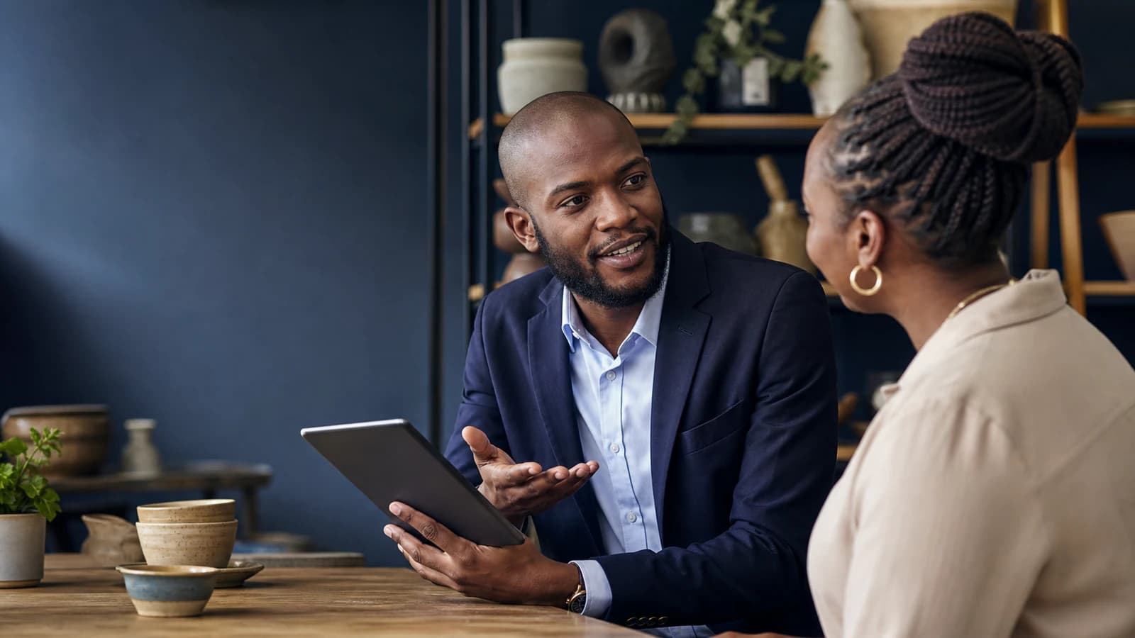 A sales professional presents a solution during a consultative client meeting.